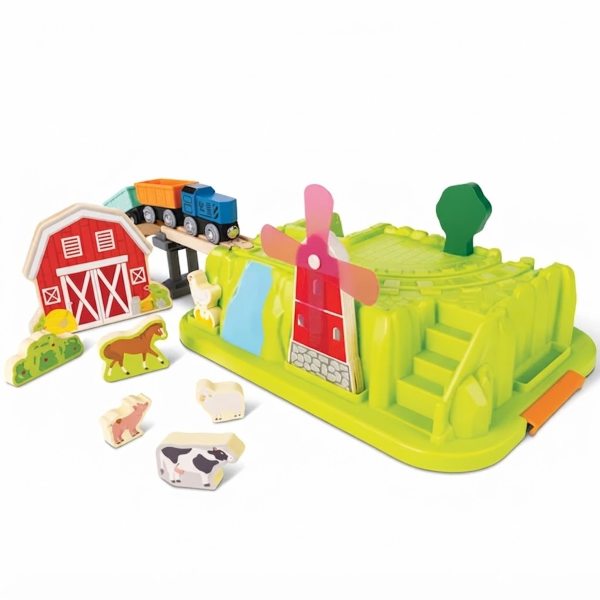 Detailed view of the hape train set farm scenery, windmill, and wooden train cars